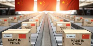 China Arms Iran—War With America Looming? Boxes labeled Made in China on conveyor belt