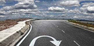 Interstate Discovery NO ONE Expected Curved road with a U-turn arrow marking.