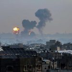 Ukrainian Drones INCINERATE Russia’s Oil Lifeline Flames and smoke billowing over a cityscape.