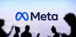 People silhouetted against Meta logo background.