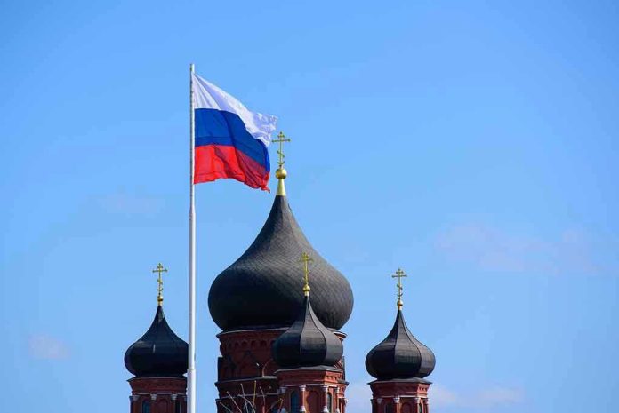 753321622 Russian flag next to church domes.