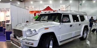 Chinese SUV’s INSANE Stats Rattle Dealerships A large white luxury SUV displayed at an auto show