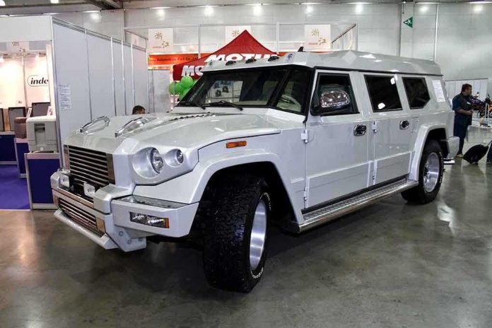 shutterstock_84269428.jpg A large white luxury SUV displayed at an auto show
