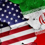 Trump’s Iran Deal: A Ticking Time Bomb? Cracked American and Iranian flags on a wall.