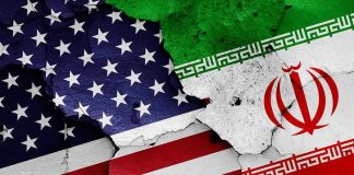 Trump’s Iran Deal: A Ticking Time Bomb? Cracked American and Iranian flags on a wall.