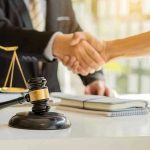 Cake Recipe Scandal Exposes Prosecutor’s Secret Hands shaking over legal documents with gavel and scales.