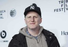 Man wearing a New York Yankees cap and casual clothing at a film festival