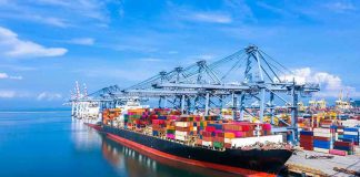 Baltic Heroin Mega-Haul Shocks Europe Container ship docked at a busy industrial port.