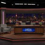 Late night talk show set with city backdrop