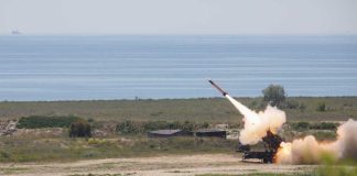 Missile Barrage Slams Gulf Surface-to-air missile launching from a coastal battery