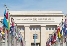 United Nations building with rows of world flags