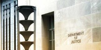 $100M Heist Suspect Deported Exterior view of the Department of Justice building with architectural features