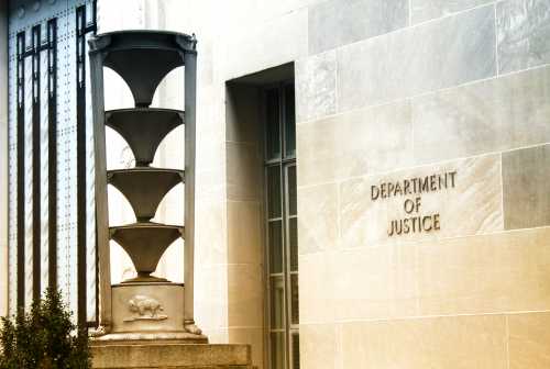 shutterstock_1275008338-1- Exterior view of the Department of Justice building with architectural features