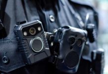 Close-up of a police officer's body camera and communication device