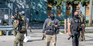 Law enforcement officers in tactical gear during an operation
