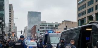 Belfast Erupts After Grisly Stabbing Police officers conducting an operation in an urban area with a crowd present