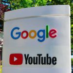 Google and YouTube logos on an outdoor office sign