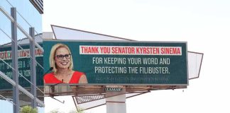 Communist Surge? White House Sounds Alarm Outdoor billboard with a smiling woman in glasses and red dress