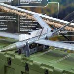 Iran Drone Kills U.S. Dad — After It’s Down small military drone displayed on a green equipment case
