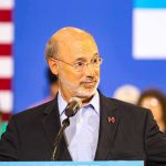 Bathroom Brawl Hijacks Senate Race Man speaking at a podium with microphone