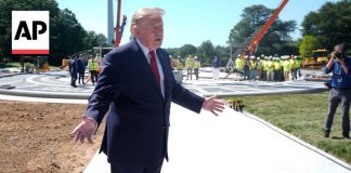 Trump shows reporters a new granite helipad at the White House