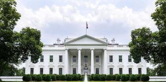 The White House with fountain and red flower bed