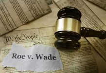Judge's gavel on U.S. Constitution with Roe v. Wade note
