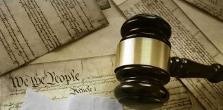 Judge's gavel on U.S. Constitution with Roe v. Wade note