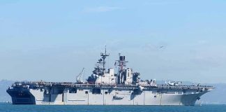 A Killing at Sea Leaves One BIG Question Aircraft carrier sailing on calm blue water
