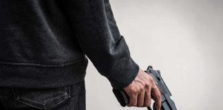 Homemade Guns, Telegram Plot Alleged person holding a handgun at their side