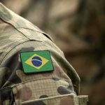 Brazil Sank a Toxic Aircraft Carrier 3 Miles Into the Atlantic Brazil flag patch on a camouflage military uniform sleeve