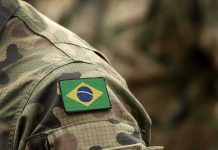 Brazil flag patch on a camouflage military uniform sleeve
