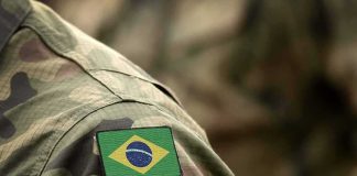 Brazil Sank a Toxic Aircraft Carrier 3 Miles Into the Atlantic Brazil flag patch on a camouflage military uniform sleeve