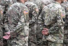 Soldiers in camouflage uniforms standing in formation