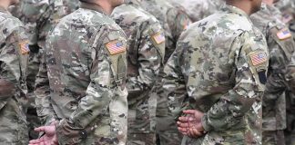 Soldiers in camouflage uniforms standing in formation