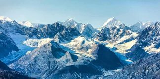 Himalayan Ice Bomb Levels Border Towns Snow-capped mountains with glaciers above a turquoise lake