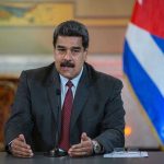 White House Call Decides Maduro’s Fate Nicolás Maduro speaking at a podium with a microphone