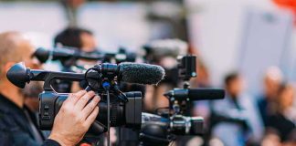 Video cameras on tripods at a media event