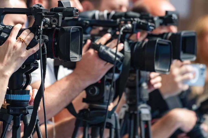 default-hero-07-4 television cameras on tripods at a media event