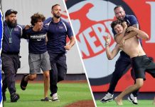 Three fans get tackled by security after storming field at ...