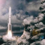 Rocket launches through dense clouds