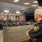 Media Dogpile Targets Lone Juror security officer overseeing a crowded school cafeteria