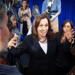 Abdul El-Sayed’s Gaza Rift With Kamala Harris Tests Alliance Kamala Harris speaks to a crowd as Maya Harris stands nearby