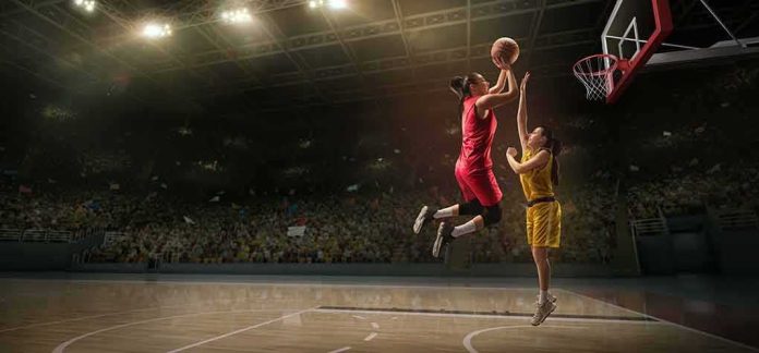 shutterstock_1411326926 Two women playing basketball; Michelle Jenneke is not visible