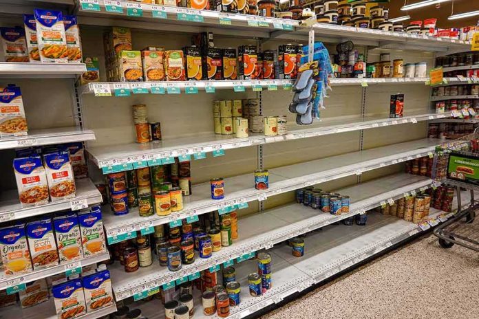 Partially empty supermarket shelves with scattered canned goods