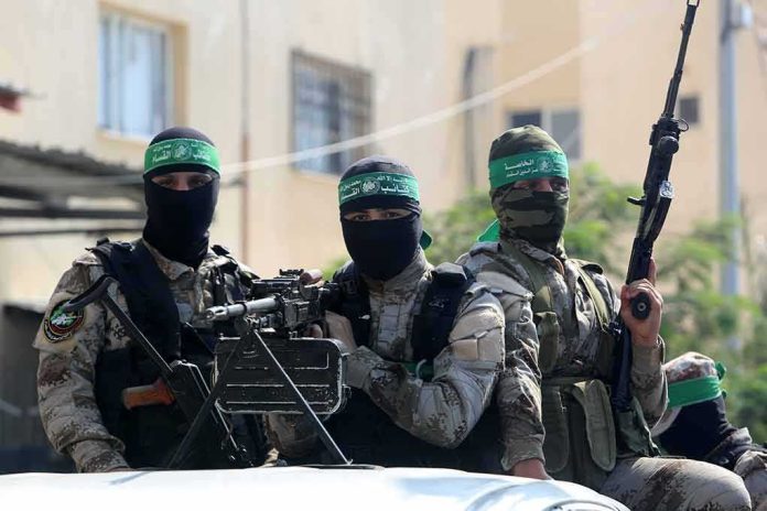 shutterstock_1534053989 armed masked men in camouflage with green headbands