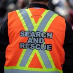 RFK Jr. Unveils New Alert System for Missing Autistic People Search and rescue worker in orange reflective vest