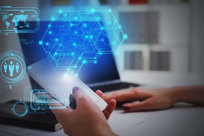 Hands using smartphone near laptop with digital hexagon interface overlay