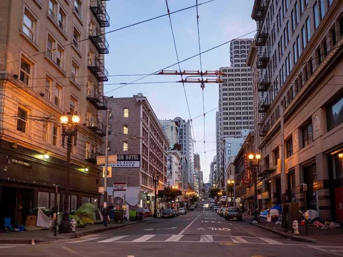 Urban street lined with mid-rise buildings at dusk