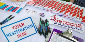 Supreme Court Just Changed the Voter Verification Fight Voter registration table with forms, pens, and informational materials